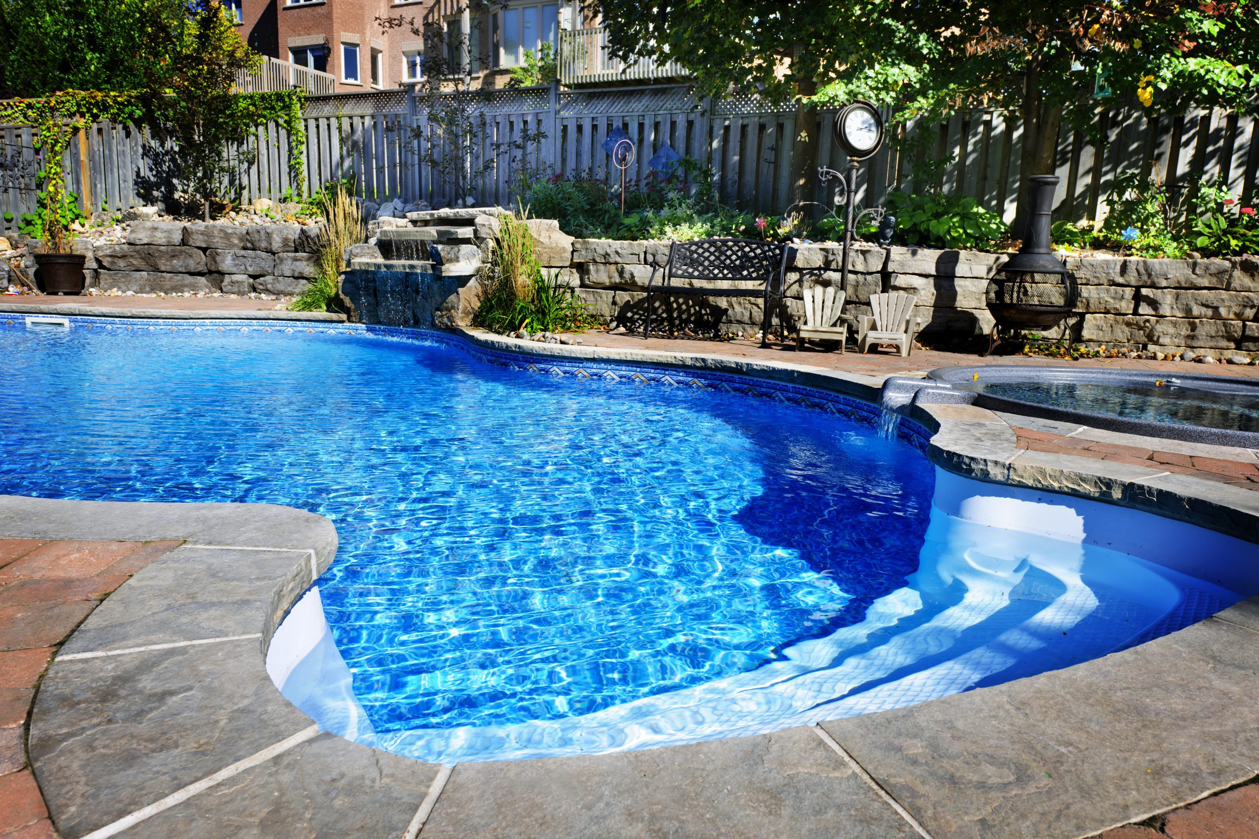 Swimming pool with waterfall